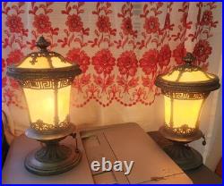 Pair of Art Deco style table lamps with amber slag glass shades and ornate metal Pair of Art Deco style table lamps with amber slag glass shades and ornate metal