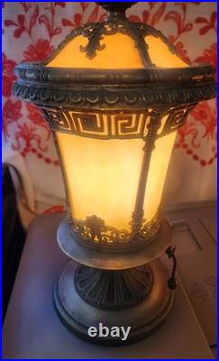 Pair of Art Deco style table lamps with amber slag glass shades and ornate metal Pair of Art Deco style table lamps with amber slag glass shades and ornate metal