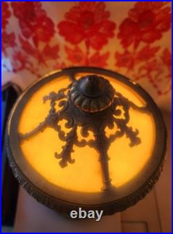 Pair of Art Deco style table lamps with amber slag glass shades and ornate metal