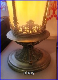 Pair of Art Deco style table lamps with amber slag glass shades and ornate metal