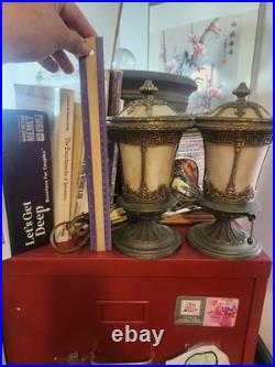 Pair of Art Deco style table lamps with amber slag glass shades and ornate metal