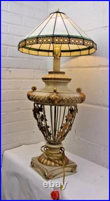 Victorian-era slag glass table lamp with a decorative metal base 1910