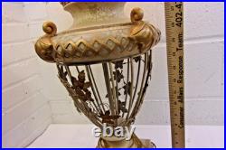 Victorian-era slag glass table lamp with a decorative metal base 1910