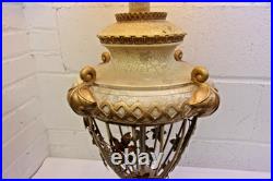 Victorian-era slag glass table lamp with a decorative metal base 1910